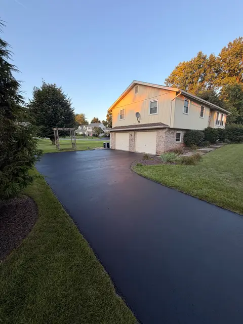 Freshly sealcoated driveway in evening light